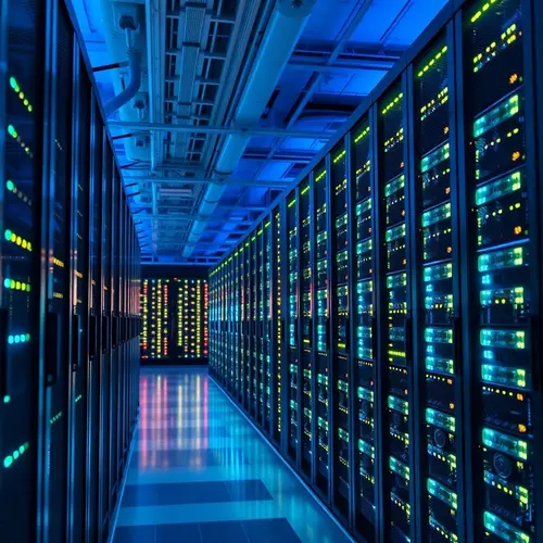 Rows of modern server racks with indicator lights in a data center environment.