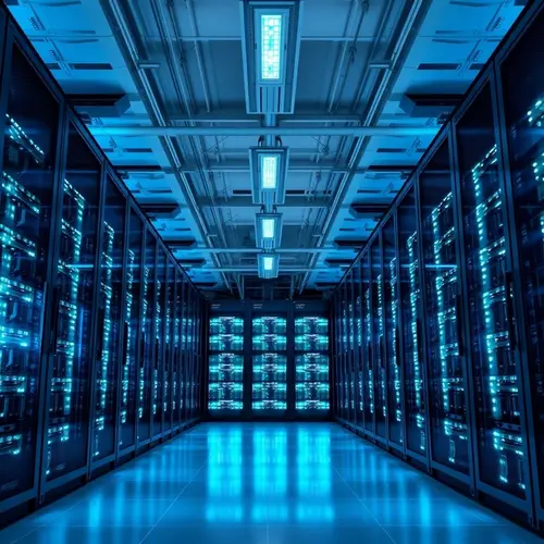 Rows of server racks glowing with blue lights in a modern data center.