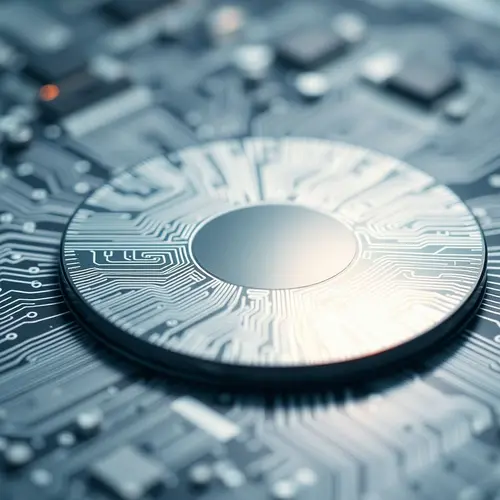 A detailed view of a silicon semiconductor wafer with visible circuit patterns.