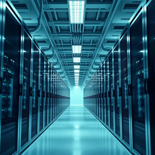 A clean, well-lit photograph showing multiple rows of server racks inside a large, modern data center.