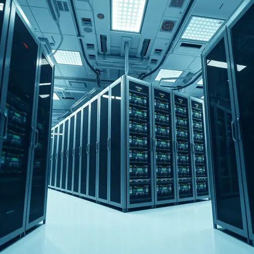 A wide shot of tall, industrial server racks in a clean, modern data center environment.