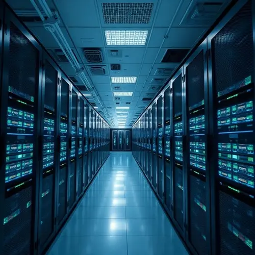 A wide shot of a large modern data center with rows of server racks illuminated by cool blue and green lights.