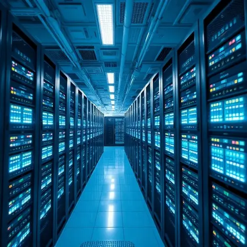 Rows of servers in a large, clean data center with cool lighting.