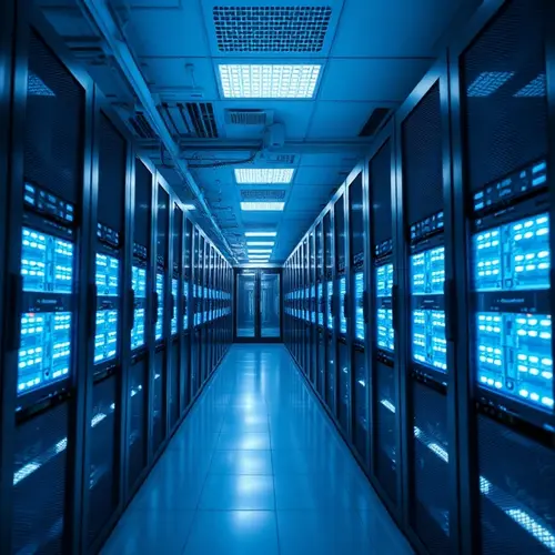 Rows of server racks with blue lights in a clean, modern data center.