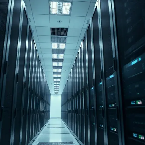 Rows of server racks in a clean, modern data center, representing digital infrastructure.