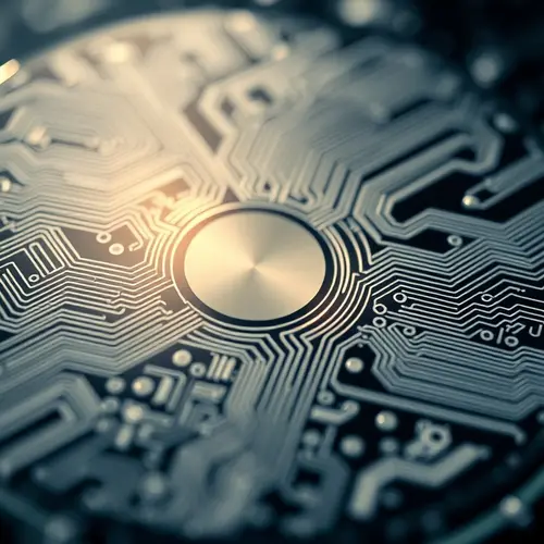 Highly detailed close-up of a silicon wafer displaying intricate circuit patterns