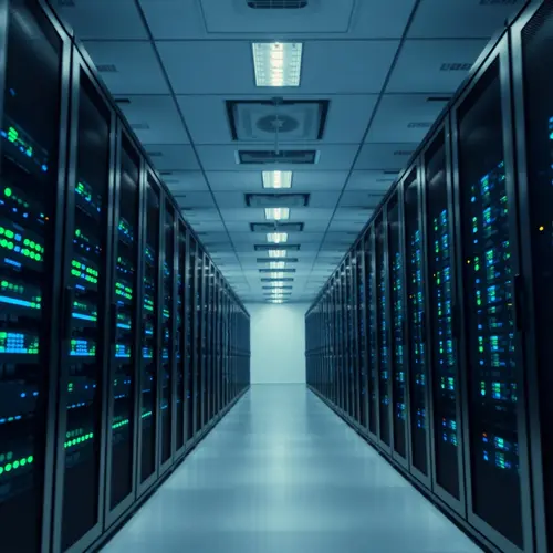 Rows of servers in a modern data center with indicator lights, depicting advanced technology infrastructure.