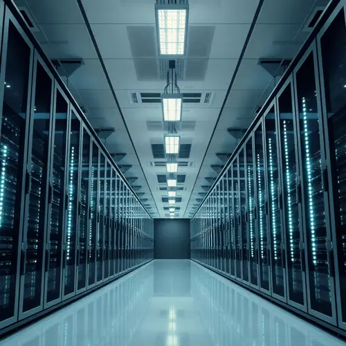 Rows of modern server racks in a well-lit data center, representing technological infrastructure.