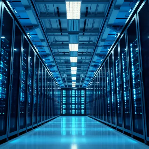 Rows of server racks illuminated with blue light in a modern data center.