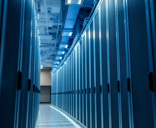 Detailed view of server racks in a modern data center with cool lighting.