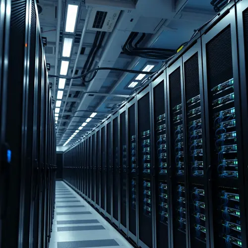 Rows of server racks and organized network cabling in a modern data center.
