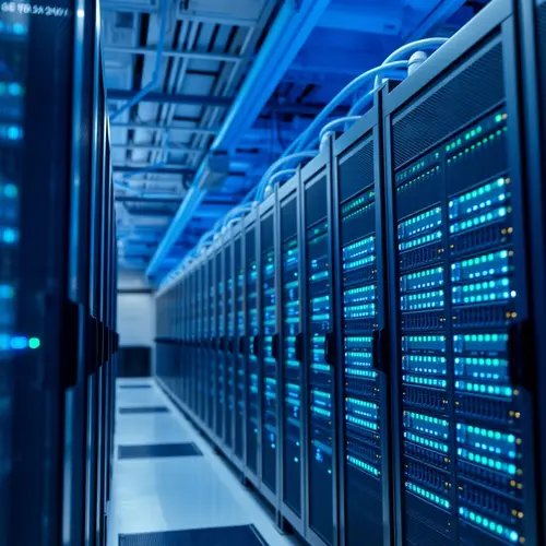 Server racks within a modern data center environment with blue lighting.