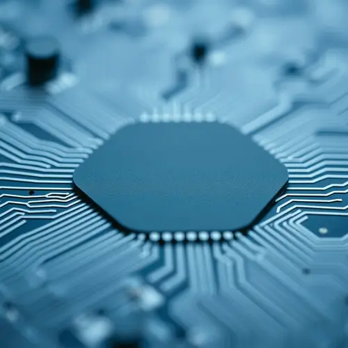 A detailed close-up view of a silicon microchip surface with intricate patterns.