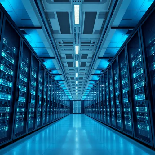 A photograph showing the interior of a modern data center with server racks.