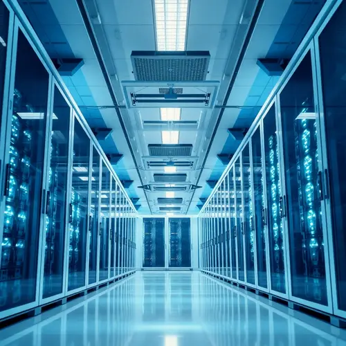 Rows of modern server racks in a clean, brightly lit data center aisle.