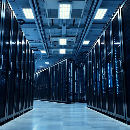 A clean, modern data center with rows of server racks under cool blue and white lighting.
