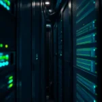 Server racks inside a modern data center with blue indicator lights, representing technological infrastructure.