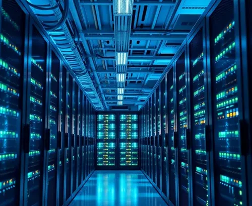 A row of server racks in a modern data center with cool blue lighting.
